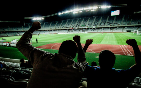 supporters at a game in a atadium